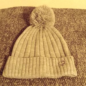Micheal Kors light gray knit pom pom beanie hat